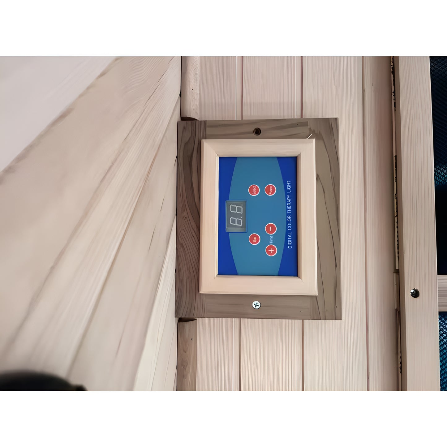 Digital thermometer mounted on a wooden wall