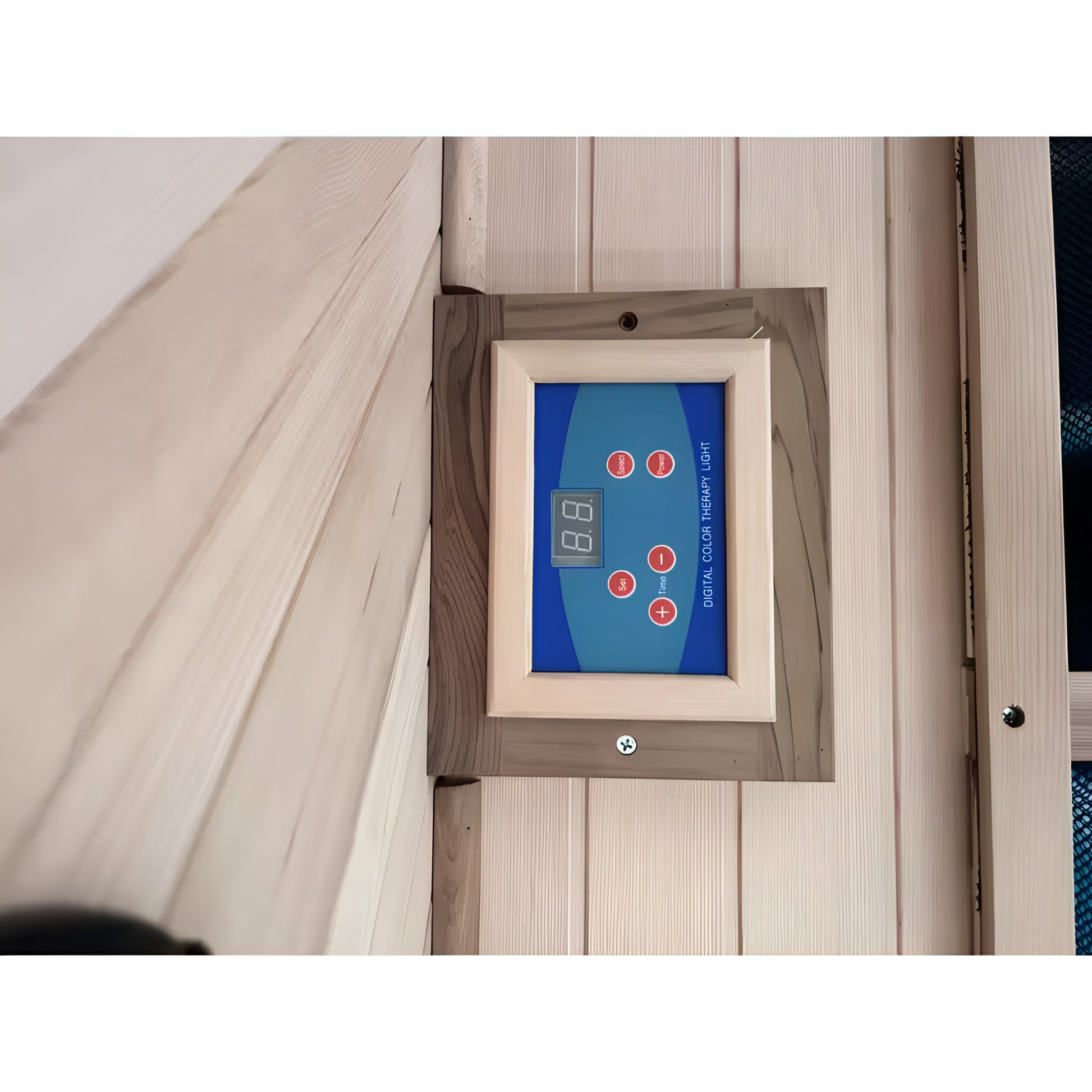 Digital thermometer mounted on a wooden wall