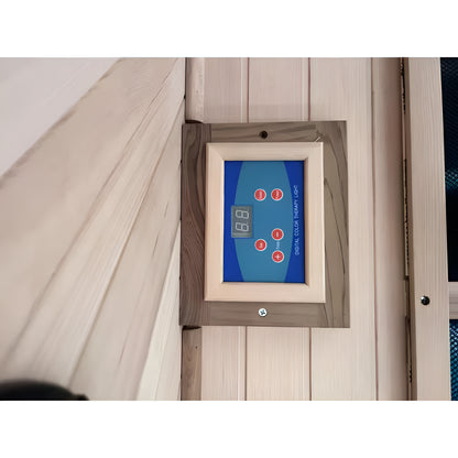 Digital thermometer mounted on a wooden wall