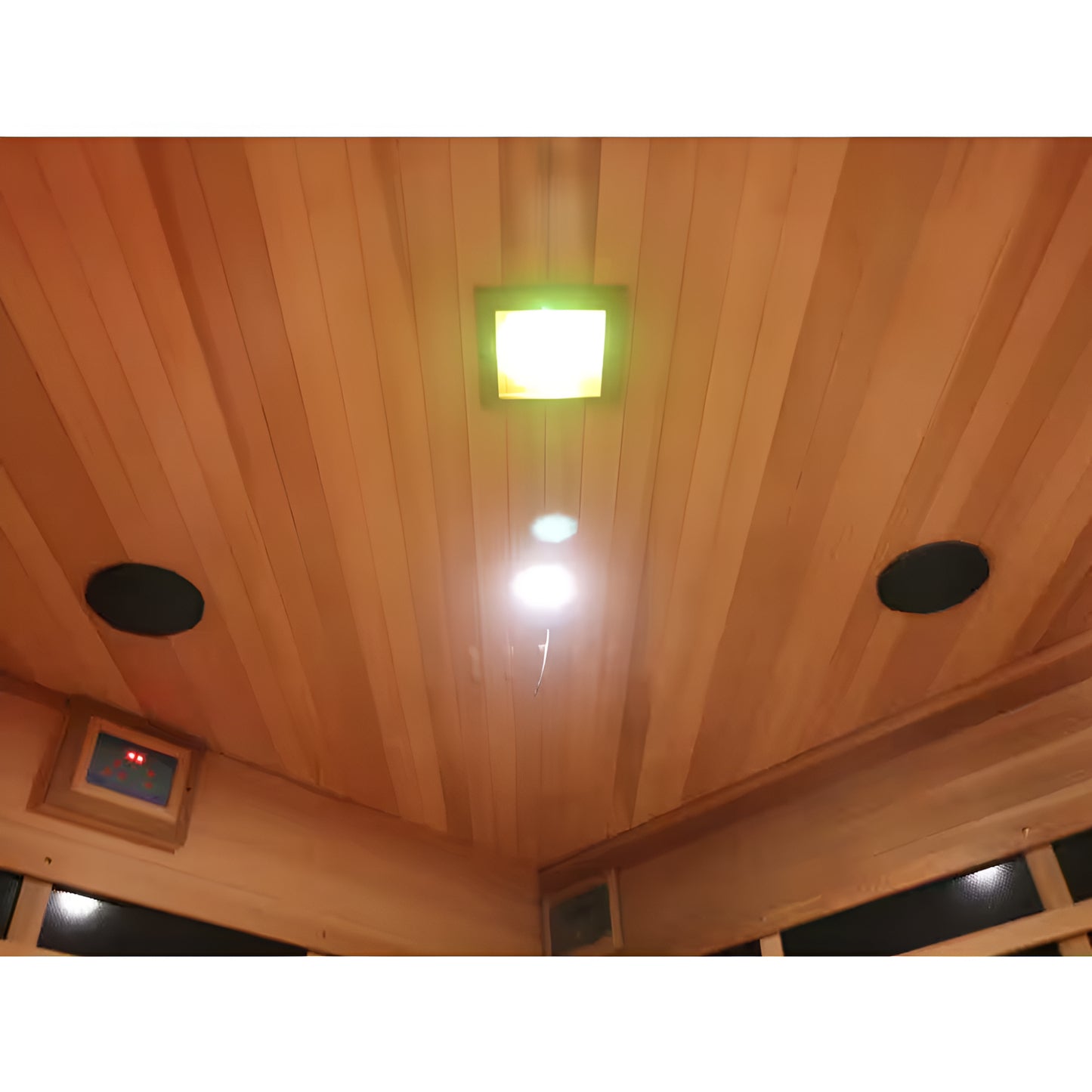 Wooden ceiling with a light fixture and speakers